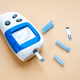 Diabetes, disease that is controlled with a glucometer, isolated on light background. - PhotoDune Item for Sale