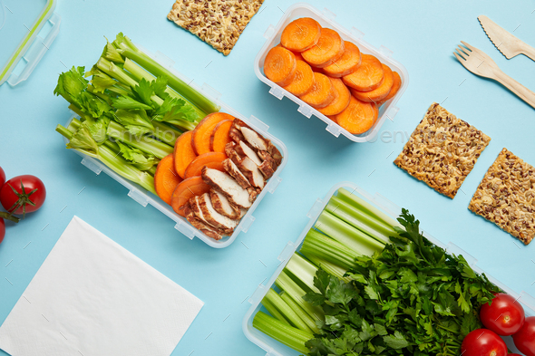 top view of arrangement of food containers with fresh healthy food ...