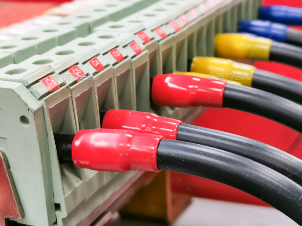 Close up image of cable distribution connection on electrical equipment in low voltage switch board.