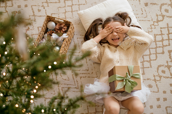 The child rejoices at the advent of xmas - Stock Photo - Images