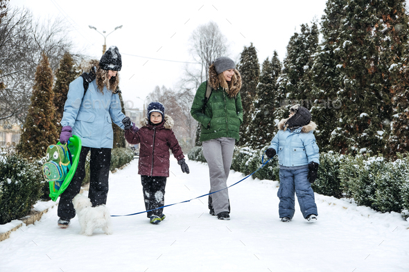 Outdoors winter activities for family, friends. Happy Family, friends, two women, two boy kids and - Stock Photo - Images