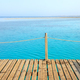 Wooden pier with rope railing, selective focus. - PhotoDune Item for Sale