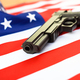 Americans are proud to bear arms, detail of a pistol on a flag. - PhotoDune Item for Sale