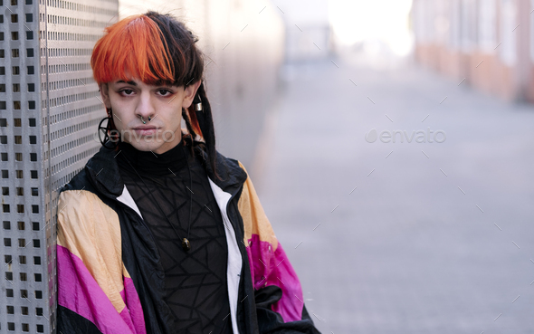 Portrait of young guy with painted hair. - Stock Photo - Images