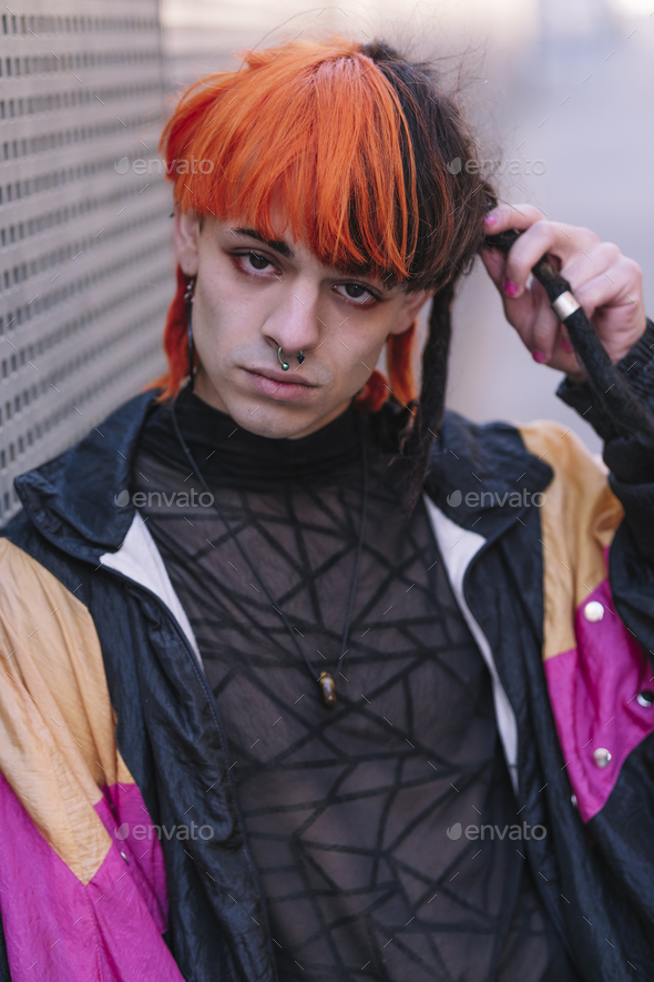 Close-up of young guy with painted hair. - Stock Photo - Images