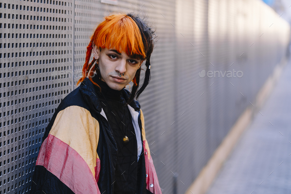 Portrait of young guy with painted hair. - Stock Photo - Images