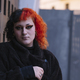 Portrait of a young transgender woman with dyed orange hair. - PhotoDune Item for Sale