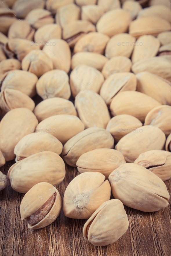Pistachio nuts as source vitamins and minerals. Healthy eating Stock Photo by ratmaner