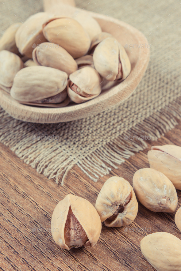 Pistachio nuts as source vitamins and minerals. Healthy eating Stock Photo by ratmaner