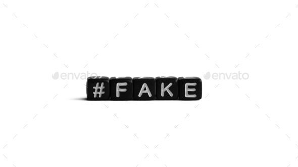 Black letter beads with hashtag and word fake on white background. Fake  news and propaganda concept Stock Photo by sungoesup