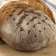 Whole German sourdough bread in a paper bag close up - PhotoDune Item for Sale
