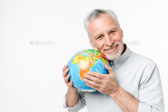 Happy caucasian middle-aged man holding hugging embracing protecting globe Earth from pollution