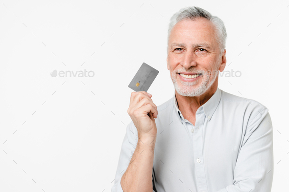 Dreamy caucasian mature senior grandfather customer client thinking buying loan, money on e-banking