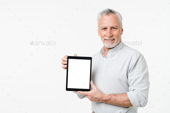Successful caucasian mature senior businessman teacher grandfather freelancer using tablet - Stock Photo - Images