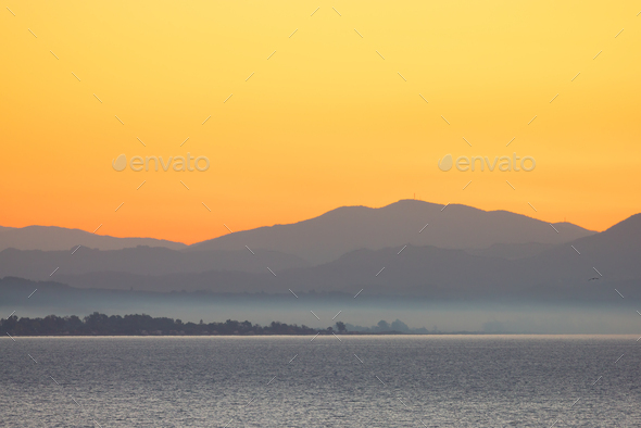 Ionian Sea with Mountain Landscape Background. Twilight Sunrise Sky. Katakolo, Greece - Stock Photo - Images