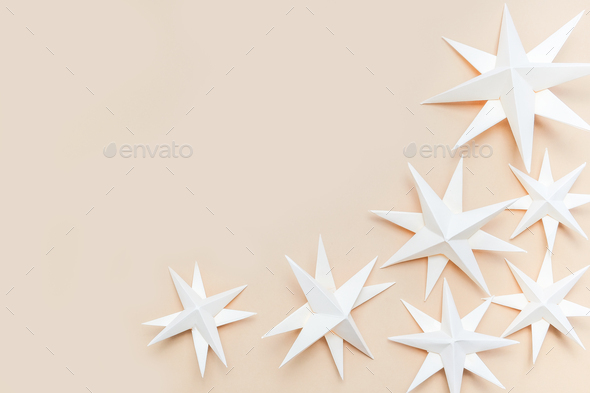 Merry Christmas.Christmas stars handmade light beige background.Monochrome,Christmas background,holi - Stock Photo - Images