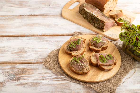Bread sandwiches with jerky salted meat, sorrel and cilantro microgreen on white. copy space. - Stock Photo - Images