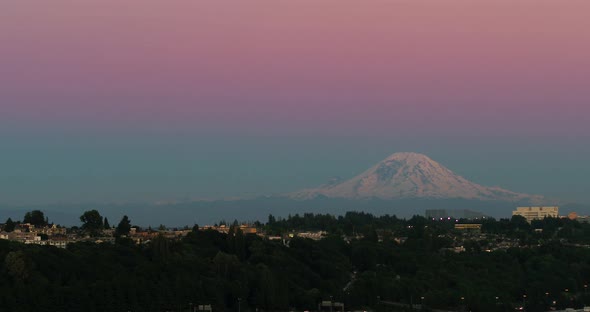Aerial shot from Seattle's perspective of Mount Rainier at sunset. alt