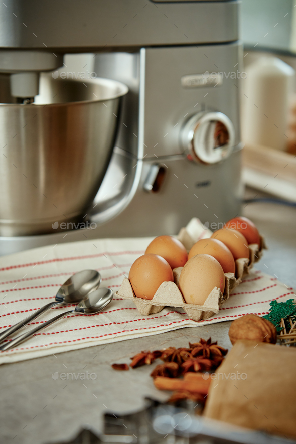 Electric mixer kneads dough in the kitchen - Stock Photo - Images