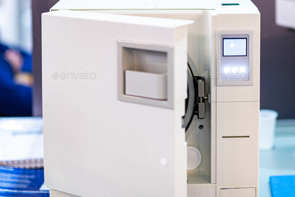 Sterilization desk with autoclave in a dental clinic.