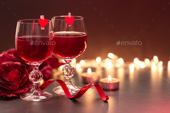 Background for Valentine's Day with glasses of wine on a blurred background. - Stock Photo - Images