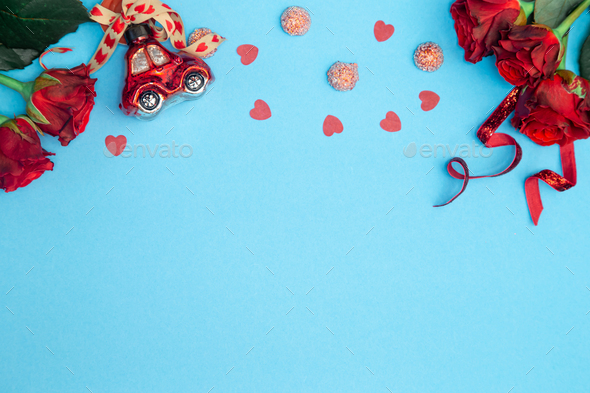 Blue background for Valentine's Day with decor details, flat lay. - Stock Photo - Images