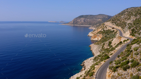 Spectacular view from drone of mountain road near the turquoise sea or ocean. - Stock Photo - Images
