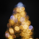 Blurred christmas tree golden festive lights in evening.  - PhotoDune Item for Sale