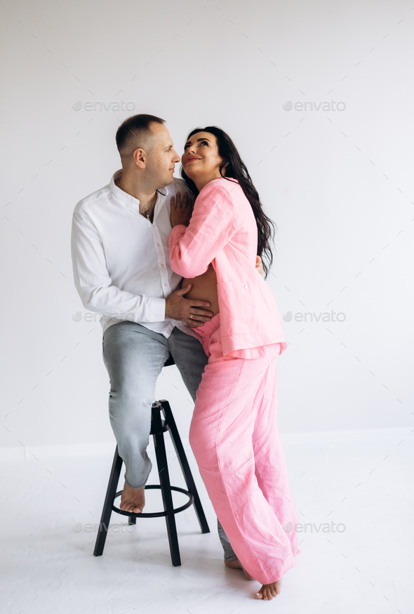 Happy family expecting a baby, concept of support and care