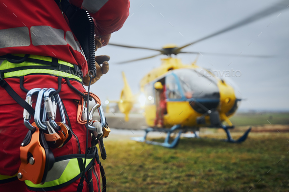 Paramedic of emergency service in front of helicopter - Stock Photo - Images