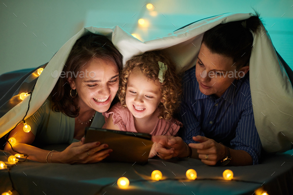 Family Watching Animated Film on Tablet - Stock Photo - Images