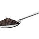 Teaspoon with black dry tea leaves isolated on white. - PhotoDune Item for Sale