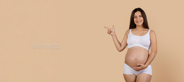 Look There. Smiling Expectant Woman In Underwear Pointing Aside At Copy Space - Stock Photo - Images
