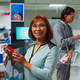 Asian woman searching for medicaments in pharmacy shop - PhotoDune Item for Sale
