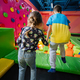 Brother with sister playing at indoor play center playground , jumping in color cubes pool. - PhotoDune Item for Sale
