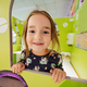 Close up portrait of girl playing at indoor play center playground. - PhotoDune Item for Sale