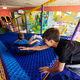 Kids playing at indoor play center playground in tubes. - PhotoDune Item for Sale