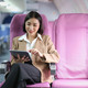 Attractive caucasian female passenger of airplane sitting in comfortable seat while working at - PhotoDune Item for Sale