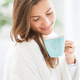 Young nice woman in bed with coffee or tea mug - PhotoDune Item for Sale