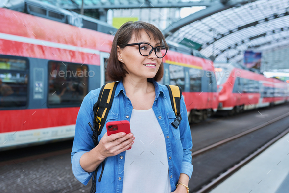 Woman passenger of urban rail transport at modern train station