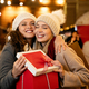 Portrait of happy women exchanging christmas presents. Holiday people christmas happiness concept - PhotoDune Item for Sale