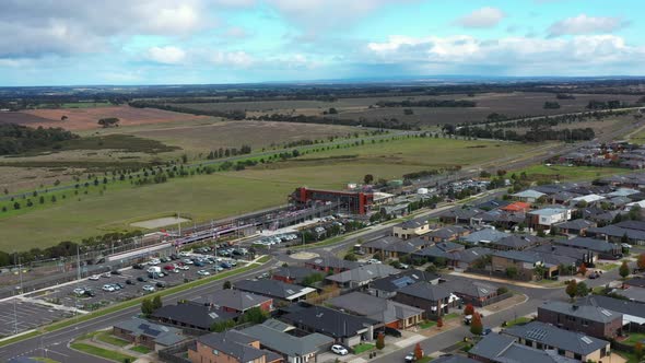 AERIAL V-Line Train at Newly Constructed Waurn Ponds Station, Australia alt
