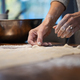 Low angle view of a woman preparing homemade pastry dough for a strudel or pie - PhotoDune Item for Sale