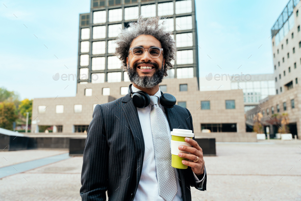 Young entrepreneur business man walking outside his office - Stock Photo - Images