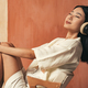 Side view of relaxed asian woman with wireless headphones, listening to meditation music - PhotoDune Item for Sale