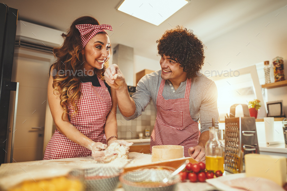 He Enjoys Helping His Wife - Stock Photo - Images