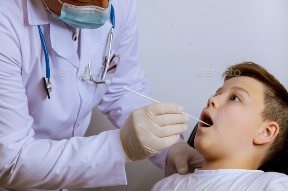 Medical worker to check in teenager on mouth swab for PLR test coronavirus for Covid-19