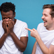 Caucasian man laughs at his friend. He won the argument. - PhotoDune Item for Sale