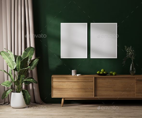 Two blank poster frames mock up on green wall with sunlight, modern room interior  - Stock Photo - Images