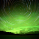Star trails and Northern lights in night sky - PhotoDune Item for Sale